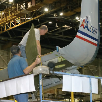 two men building an airplane